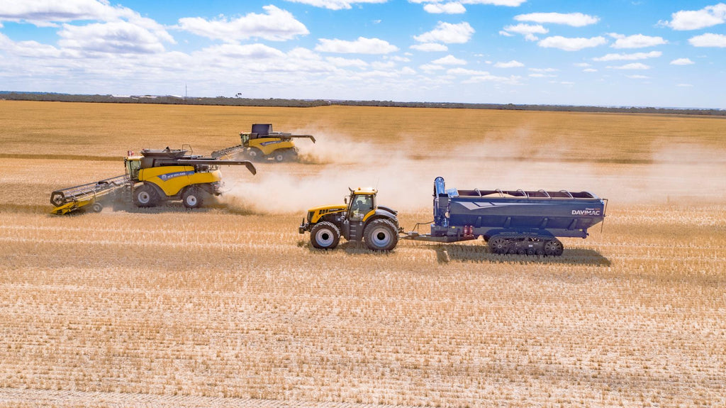 Davimac Chaser Bin on tracks with New Holland machinery