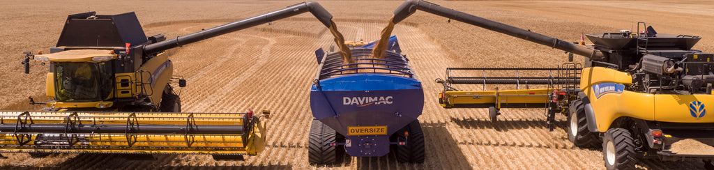 two combine harvesters unload into a Davimac chaser bin with Vimcor tracks